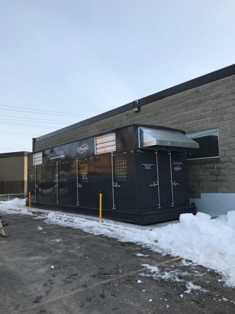 Mobile compressor room exterior solution near industrial building